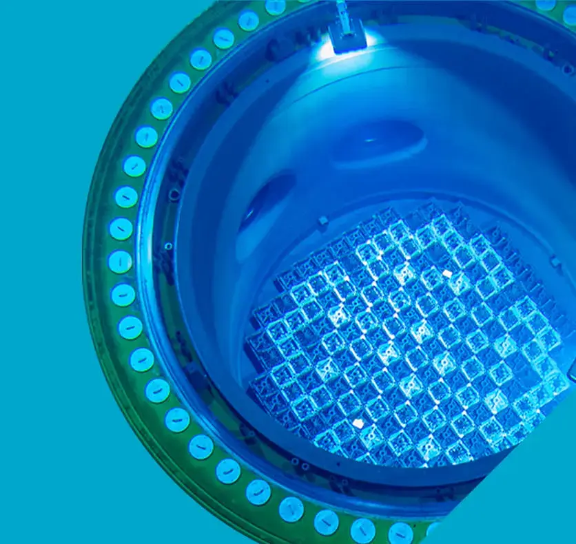 Top-down view of a nuclear reactor core glowing blue.